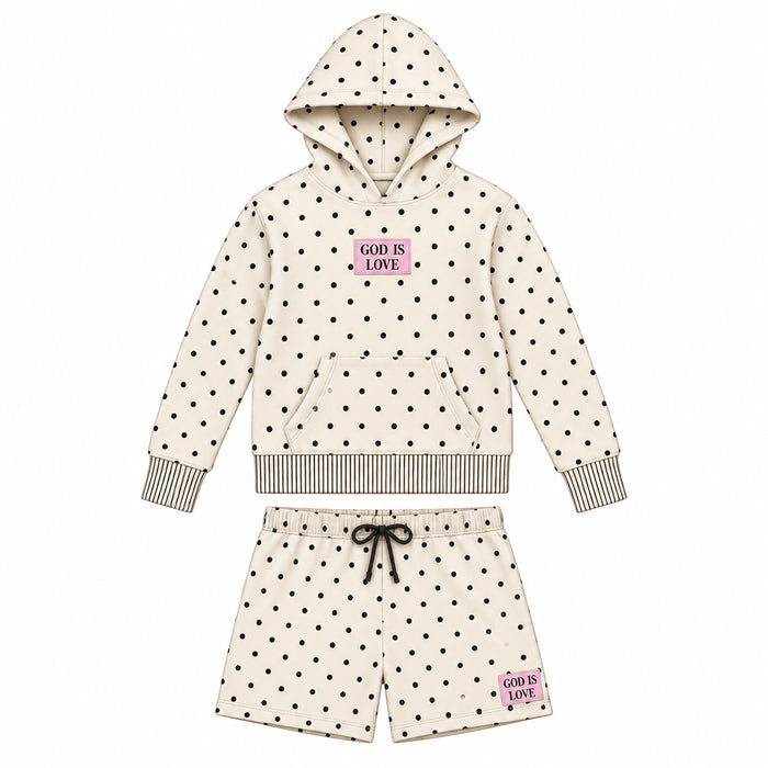 A flat line drawing of a two-piece children's fleece set, featuring a hooded sweatshirt and matching shorts. The fleece is off-white with a small black polka dot pattern, a pink 'LOVE IS LOVE' graphic on the chest, and a small matching graphic on the thigh.