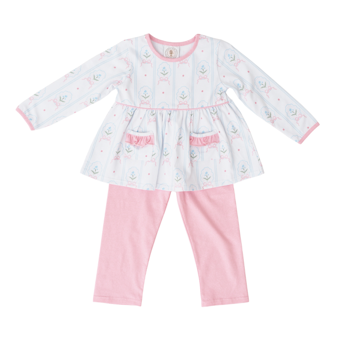 Baby girl's outfit with a white dress and pink pants on a white background