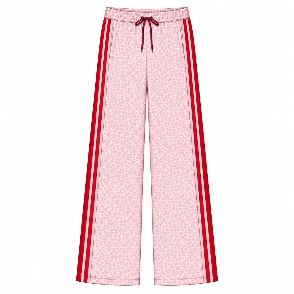 A flat technical drawing of wide-leg pants on a white background, labeled with style code H085890211 and material text reading 'GARDENIA COTTON POLY FLEECE.' The pants are light pink with a dense small floral print and bold red side stripes, plus a dark red drawstring at the waist.