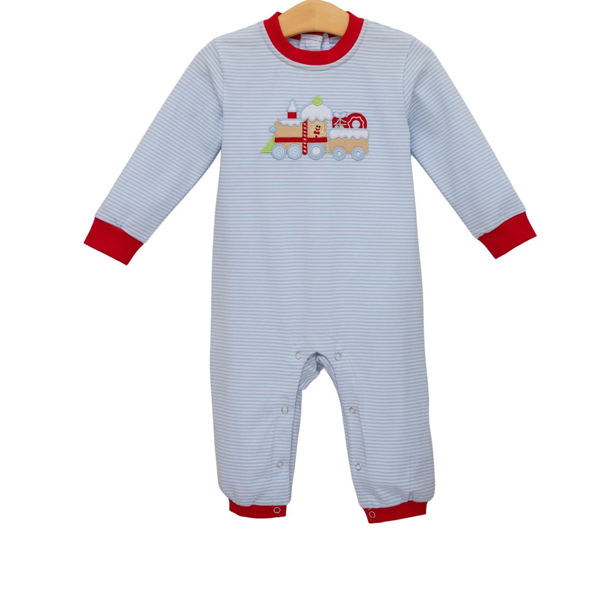 Baby onesie with red trim and train design on a white background