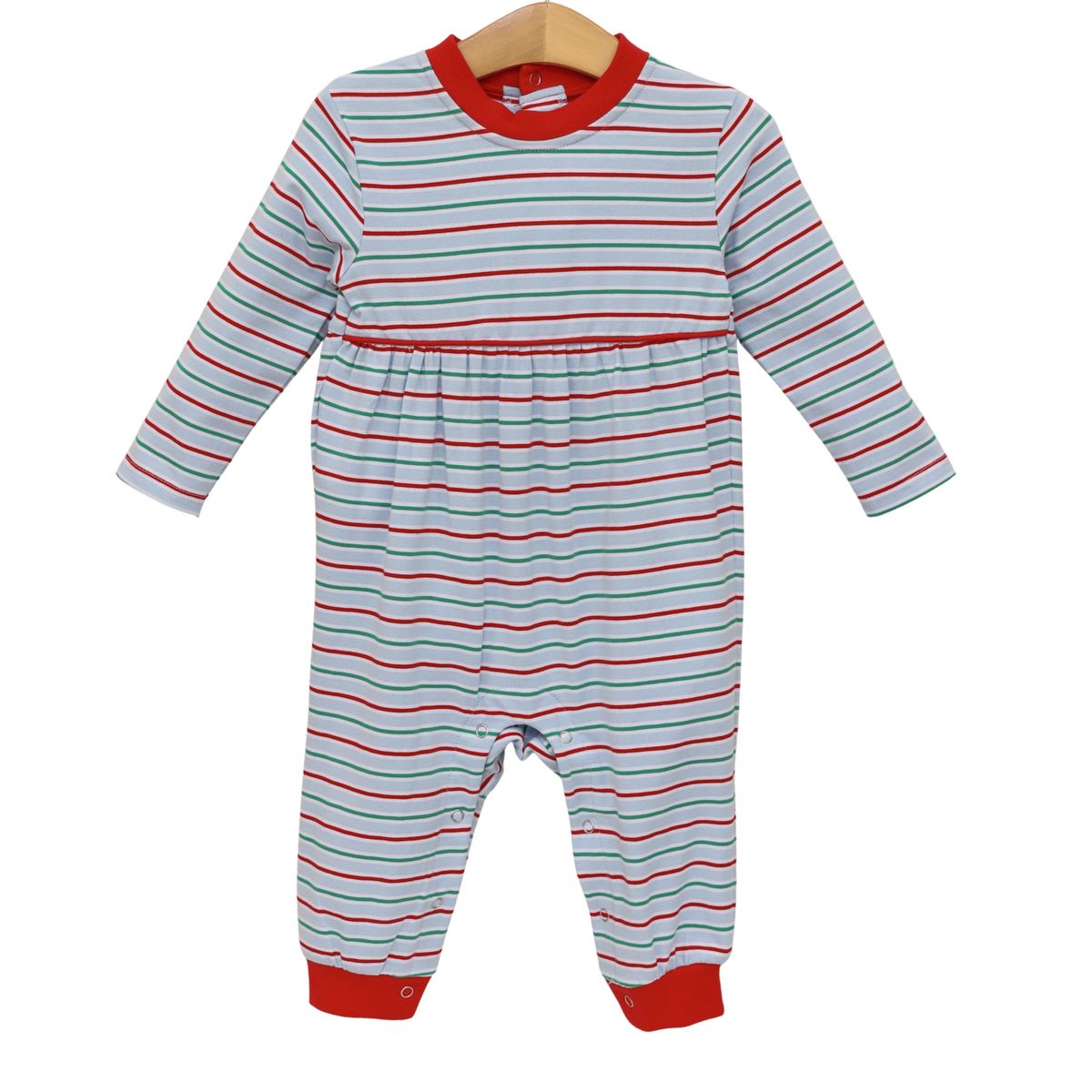 A baby long-sleeve footless romper with thin red and light blue horizontal stripes, featuring a solid red crew neck, red cuffs, and a red waistband, hanging on a wooden hanger against a white background.