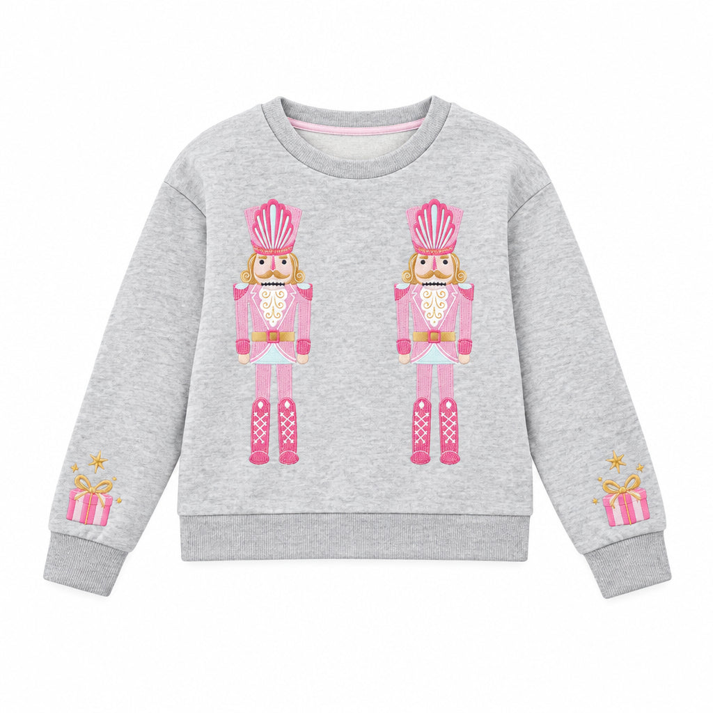 Gray fleece sweatshirt with pink nutcracker design and embroidery details on a white background.