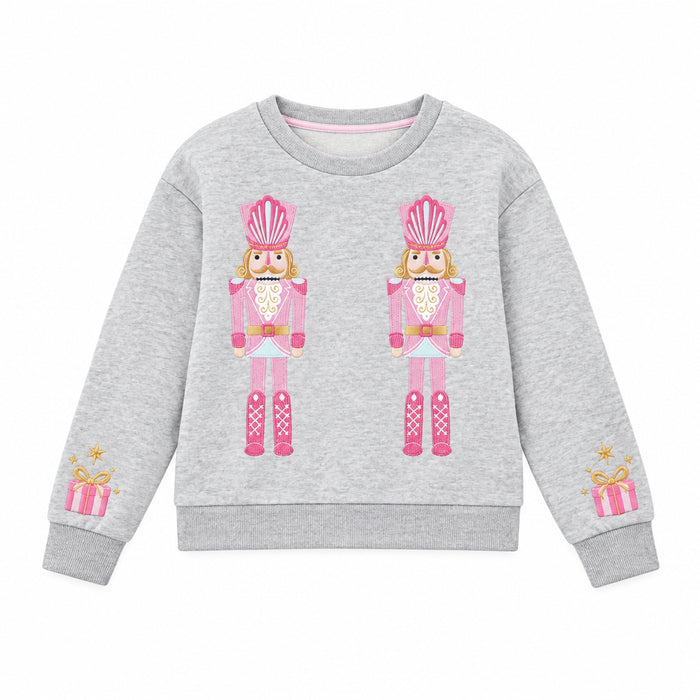Gray fleece sweatshirt with pink nutcracker design and embroidery details on a white background.