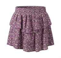 Purple floral skirt with ruffled layers on a white background