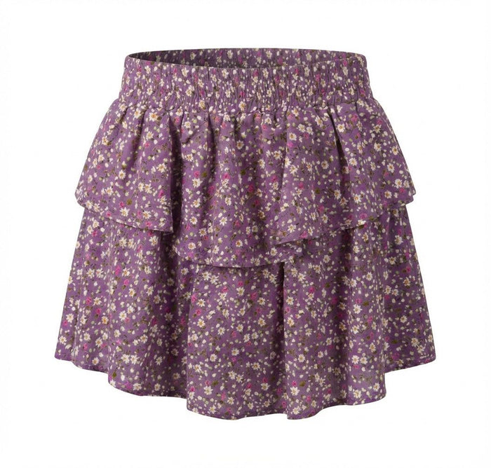 Purple floral skirt with ruffled layers on a white background