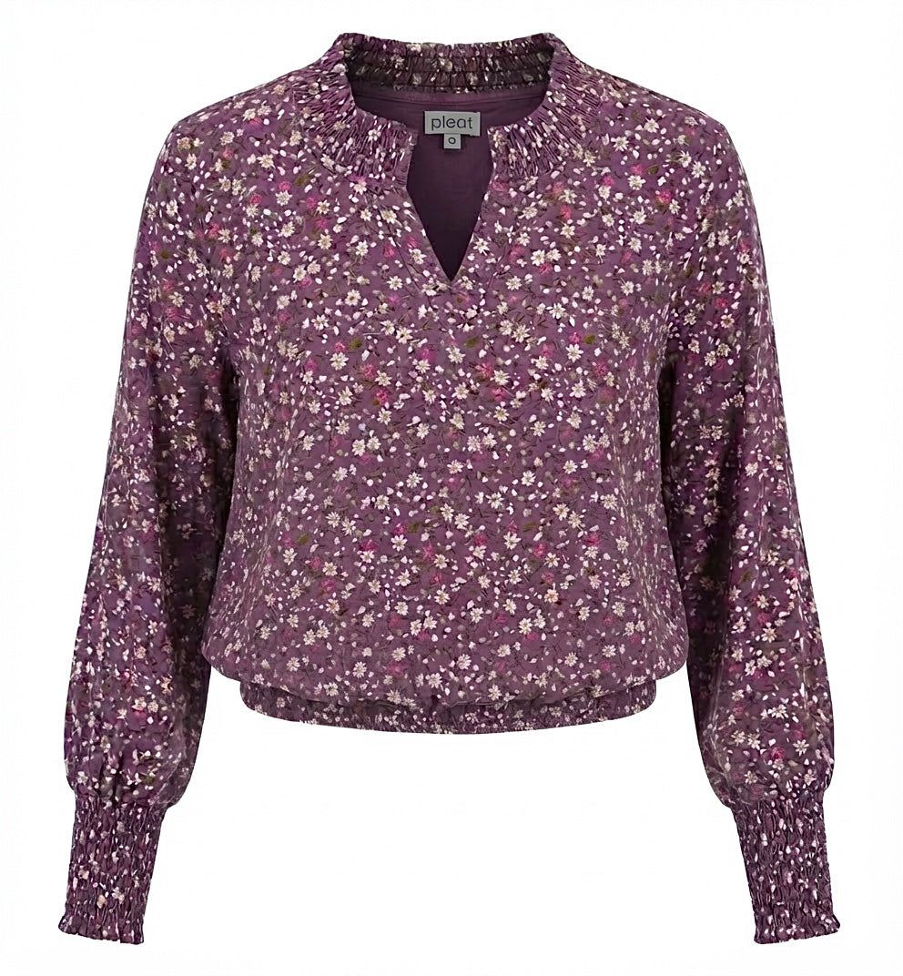 Floral patterned blouse on a white background