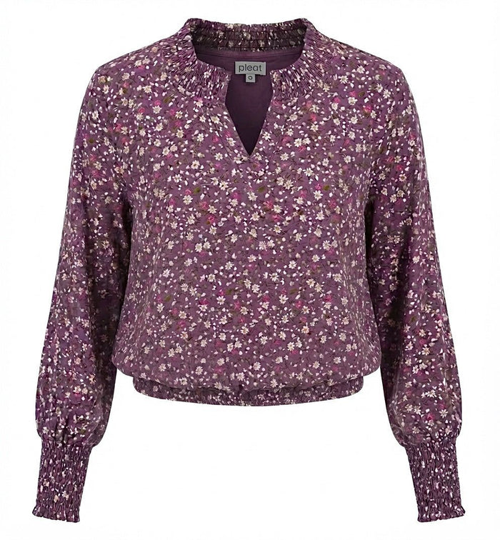 Floral patterned blouse on a white background