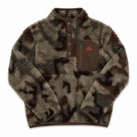 A fleece pullover jacket with a brown and beige camouflage pattern, featuring a brown chest pocket with a vertical zipper and a small red logo, laid flat on a white background.