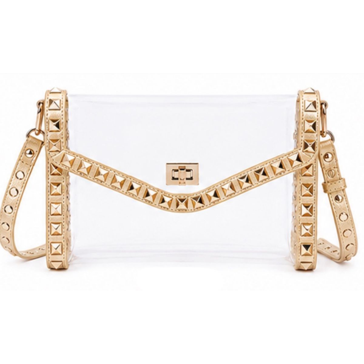 A clear vinyl clutch bag with a gold-tone metal frame, pyramid stud embellishments, and a matching gold shoulder strap, shown against a plain white background.
