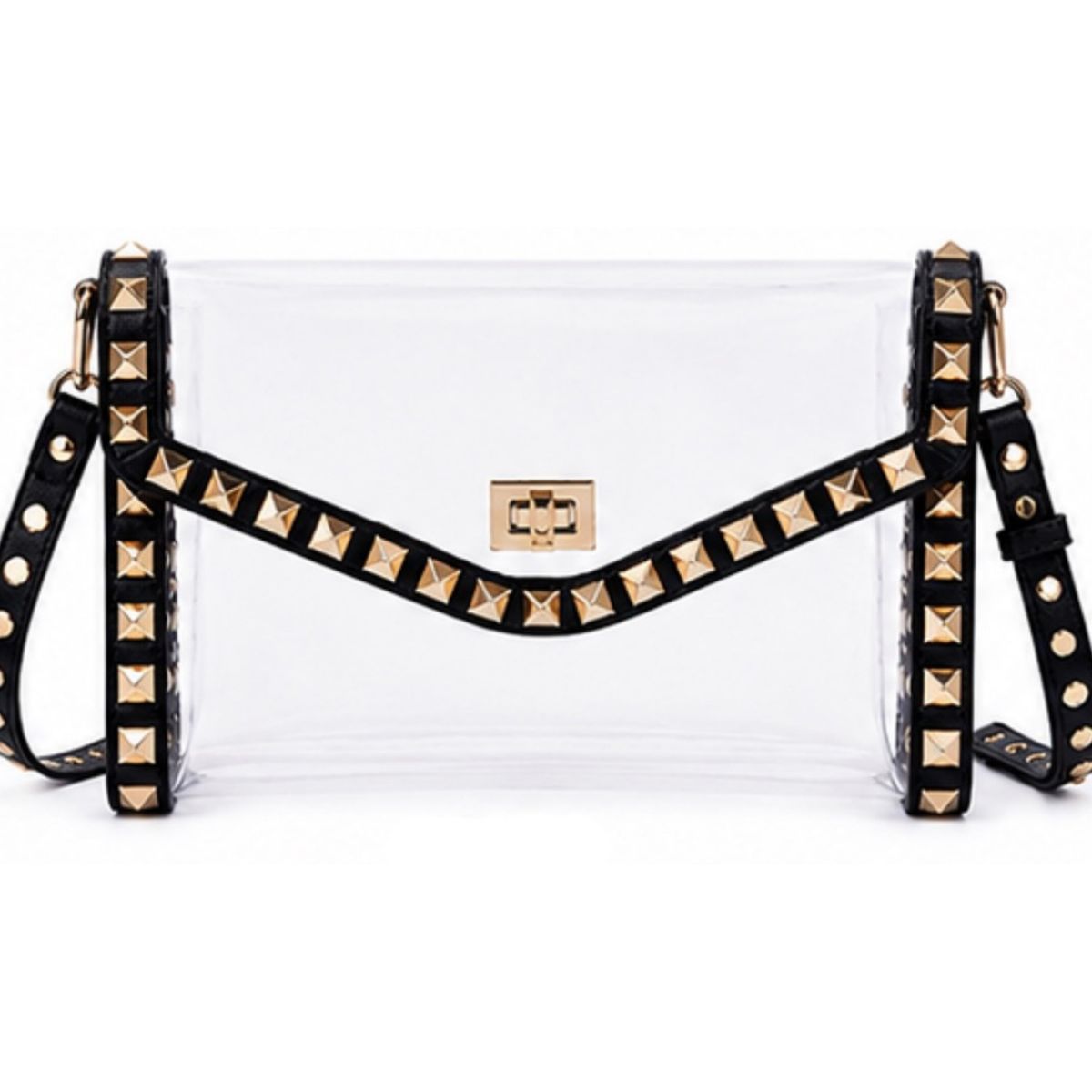 A clear plastic crossbody bag with a black studded strap and gold-tone hardware, shown against a plain white background.