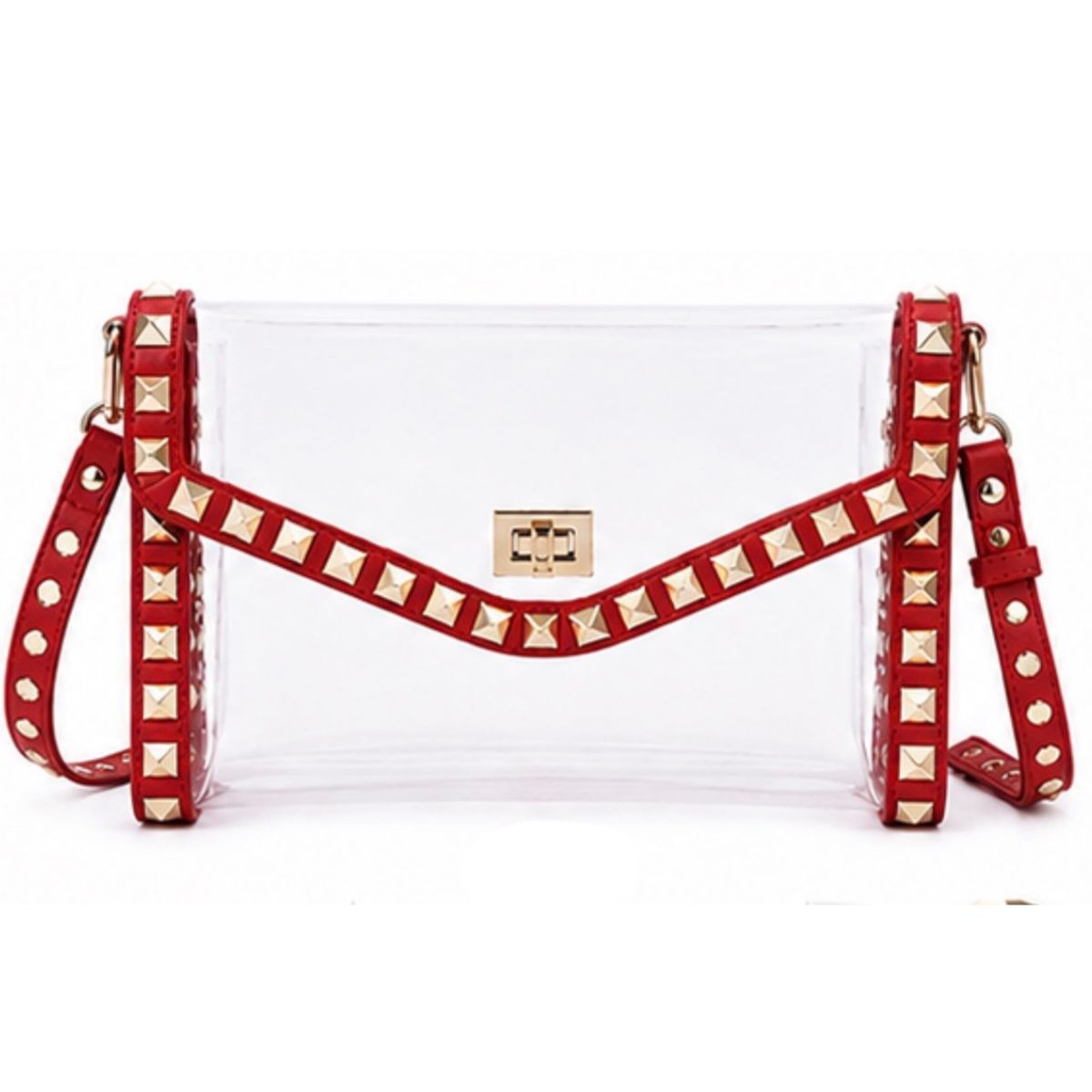 A clear plastic handbag with a red faux-leather flap and shoulder strap adorned with gold studs, set against a plain white background.