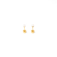 Gold earrings with small round stones on a white background