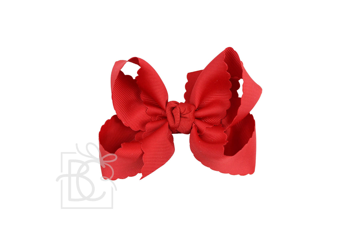 Red hair bow on a white background