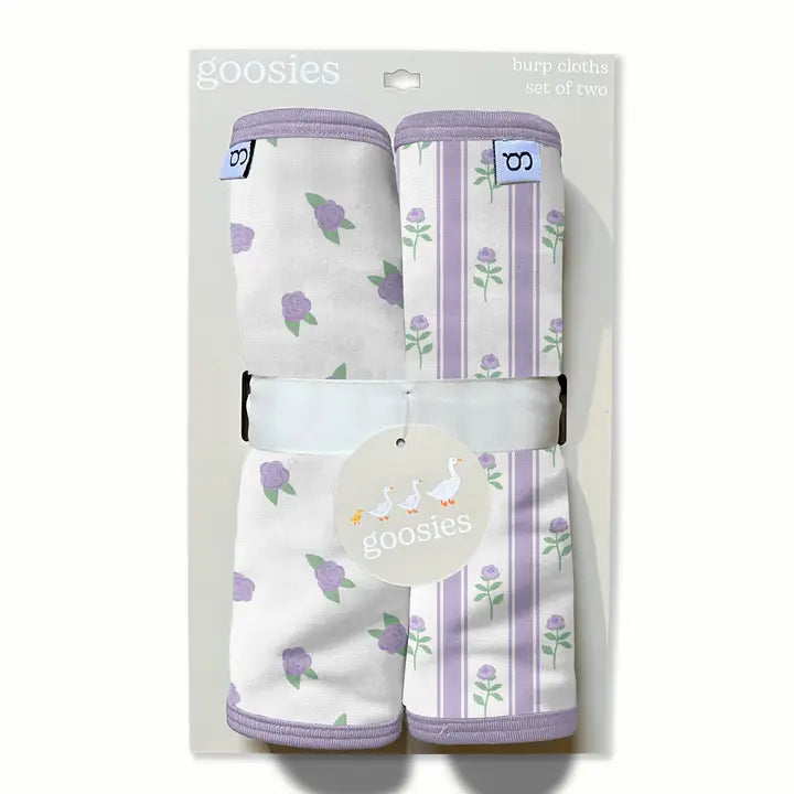 Goosies burp cloths set of two in a clear plastic package, featuring a white fabric with purple tulips and lavender stripes with white goslings.