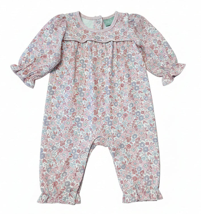 A baby girl's long-sleeve romper with a dense floral pattern in dusty pink, blue, and green, featuring a ruffled collar and elasticated leg cuffs, shown flat on a white background.