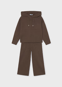 A two-piece children's knit set in a solid dark brown color, featuring a hooded long-sleeve top with drawstrings and matching wide-leg pants, displayed on a light gray background.
