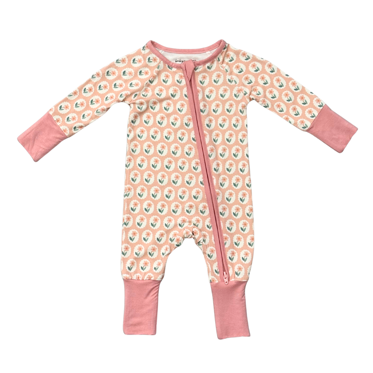 A baby long-sleeve footless one-piece sleeper with a pink and peach background, featuring a repeating pattern of small white and green cartoon animals, and solid pink cuffs and zipper trim.