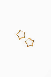 Gold geometric hoop earrings on a white background