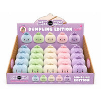Super Sugar Bites Super Squishee Dumpling Edition display box containing 24 pastel-colored plush dumpling toys arranged in rows on a purple and brown cardboard stand.