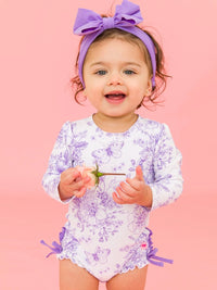 RUFFLEBUTTS WISTERIA PURPLE BUTTERFLY GARDEN TOILE LONG SLEEVE RASH GUARD