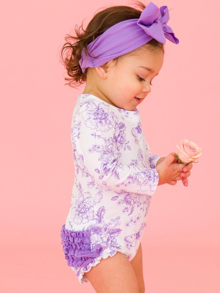 RUFFLEBUTTS WISTERIA PURPLE BUTTERFLY GARDEN TOILE LONG SLEEVE RASH GUARD