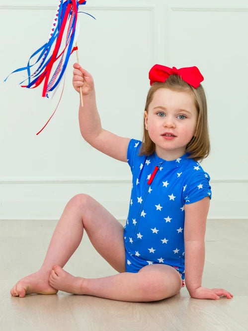 RUFFLEBUTTS SHIMMER STARS & STRIPES GIRLS SHORT SLEEVE ONE PIECE RASH GUARD