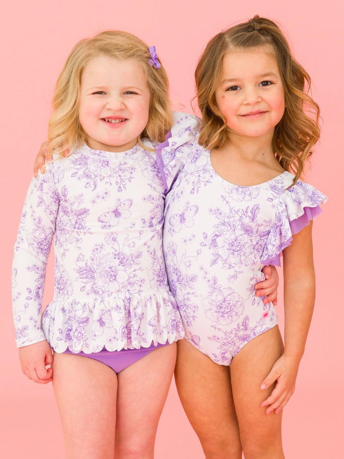 RUFFLEBUTTS WISTERIA PURPLE BUTTERFLY GARDEN TOILE SCALLOP HEM RASH GUARD