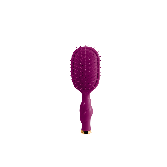 A purple oval hairbrush with a twisted handle and a small gold accent at the base, shown against a plain white background.