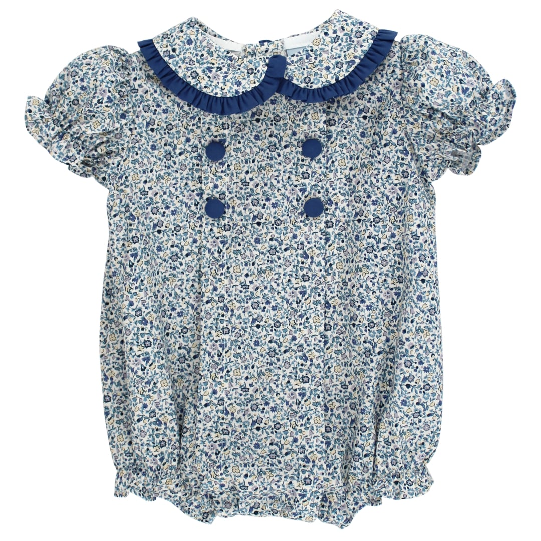Baby romper with floral pattern and blue trim on a white background