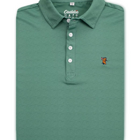 A folded sage green polo shirt with a textured wavy pattern, featuring a white button placket and a small embroidered fox logo on the left chest.