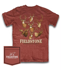 A rust-red short-sleeve t-shirt with a graphic print of various deer and moose heads on the back, featuring the text 'FIELDSTONE SPORTING LIFESTYLE BRAND'. A matching fabric pocket is shown in the bottom-left corner with the Fieldstone logo.
