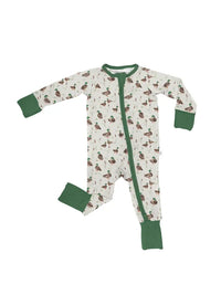 A baby long-sleeve footed sleeper with an all-over duck print on an off-white background, featuring solid green cuffs, collar, and zipper trim.