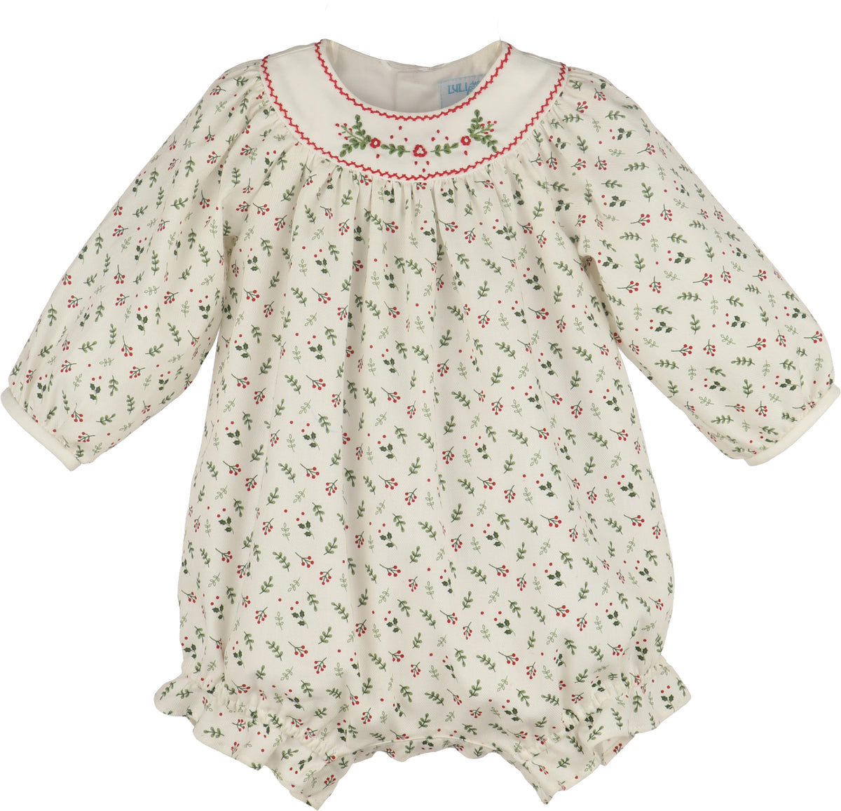A baby long-sleeve romper in cream cotton fabric with a small green and red floral print, featuring a smocked neckline with red trim and green floral embroidery.