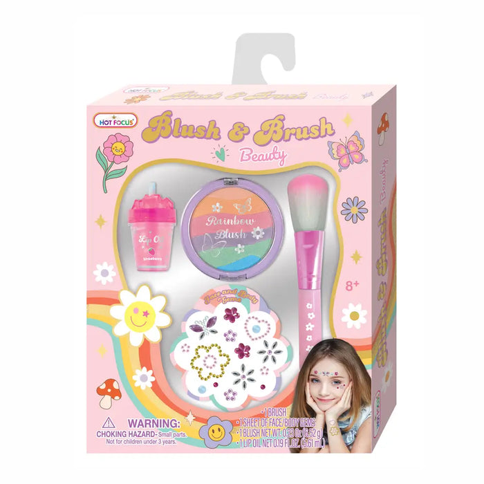 Hot Focus Blush & Brush Beauty toy set in its original pink packaging, featuring a pink sippy cup, round rainbow blush compact, and pink makeup brush.