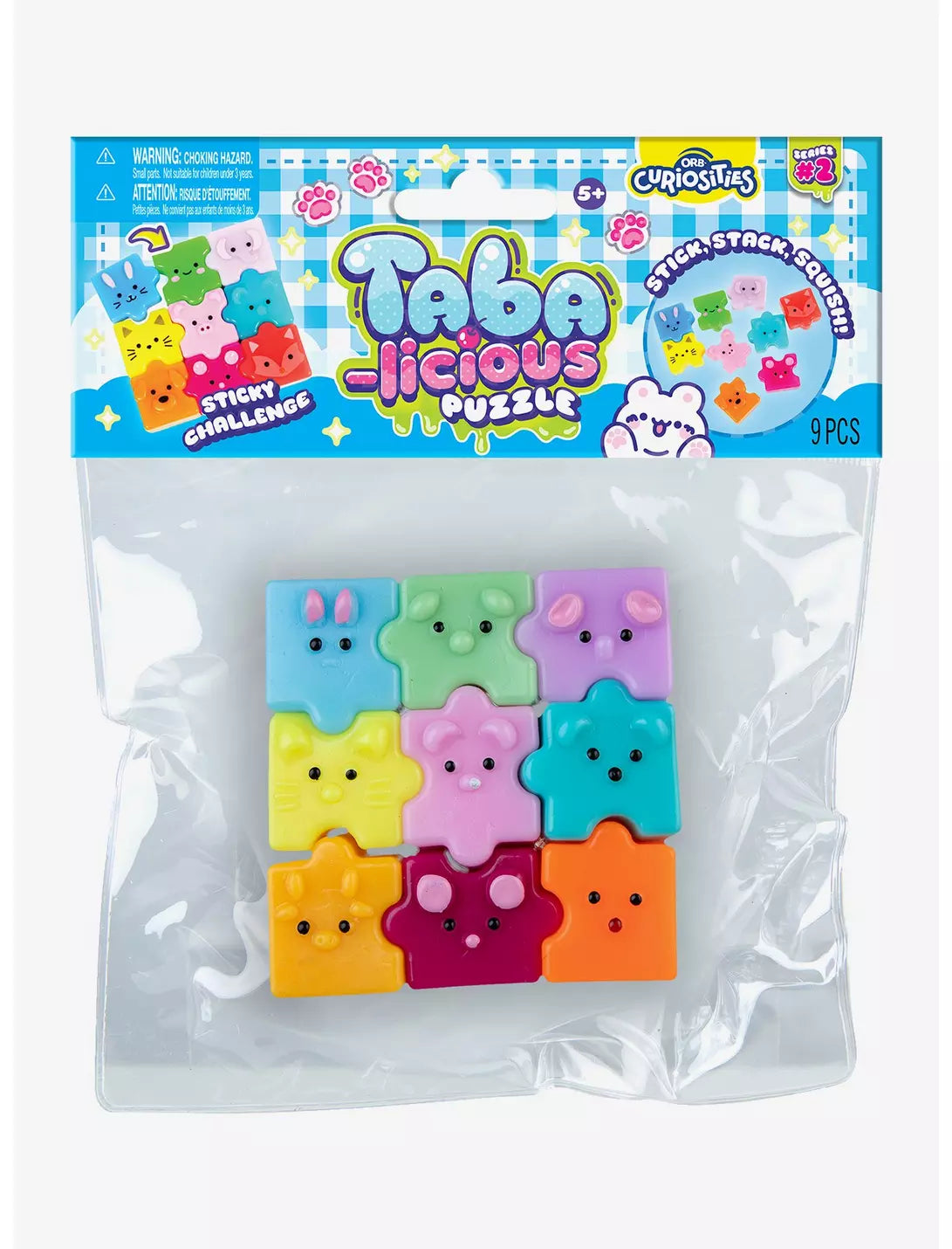 A 9-piece set of Taba Jocious Puzzle toys in a clear plastic bag with a colorful header card. The puzzle pieces are shaped like marshmallows and come in multiple pastel colors including blue, green, purple, yellow, pink, and orange, each with a simple face.