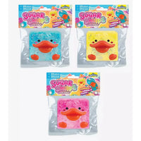 Three packaged Squishy Snaps duck cookies shown on a white background: one blue, one yellow, and one pink, each with an orange duck face and glittery texture. The packages feature colorful headers with the brand name 'Squishy Snaps' and product title 'Frozen Feast Duck Cookies'.