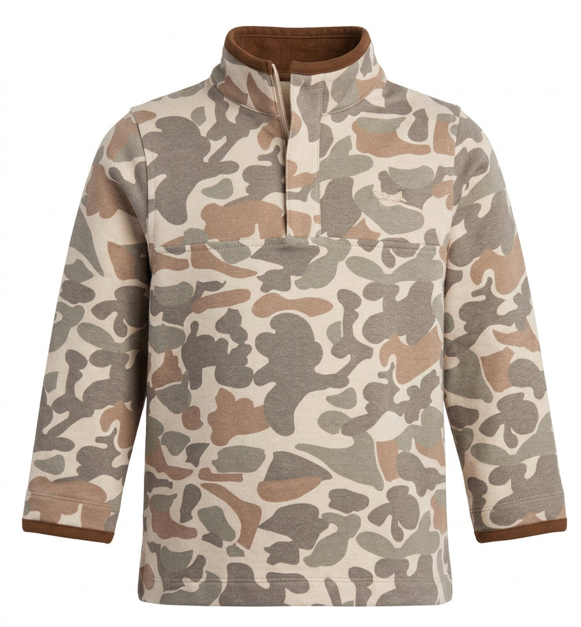 A long-sleeve quarter-zip pullover sweatshirt with a brown and beige camouflage pattern, hanging on a clear plastic hanger against a rustic brick wall background.