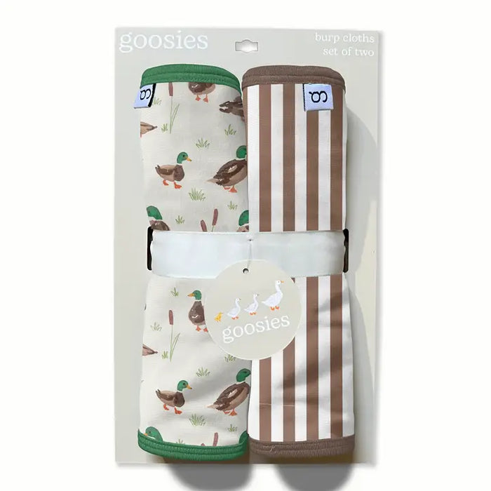 Goosies burp cloths set of two in retail packaging, featuring one cream cloth with a duck print and one brown-and-cream striped cloth, tied together with a white band and a round Goosies tag.