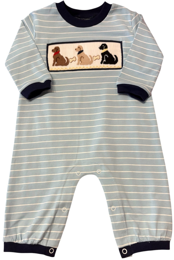 A baby long-sleeve romper with light blue and white horizontal stripes, featuring a rectangular chest graphic of three dogs in different breeds. The romper has dark navy blue trim at the crew neck, cuffs, and hems, and is shown against a plain white background.
