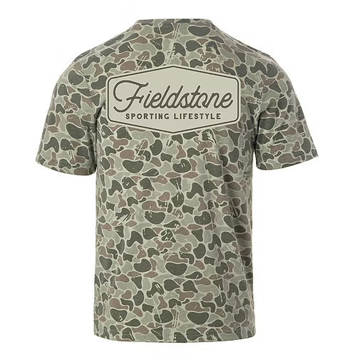 A short-sleeve crewneck t-shirt featuring an all-over green and brown camouflage pattern, with a large cream-colored rectangular patch on the back displaying the text 'Fieldstone SPORTING LIFESTYLE'.