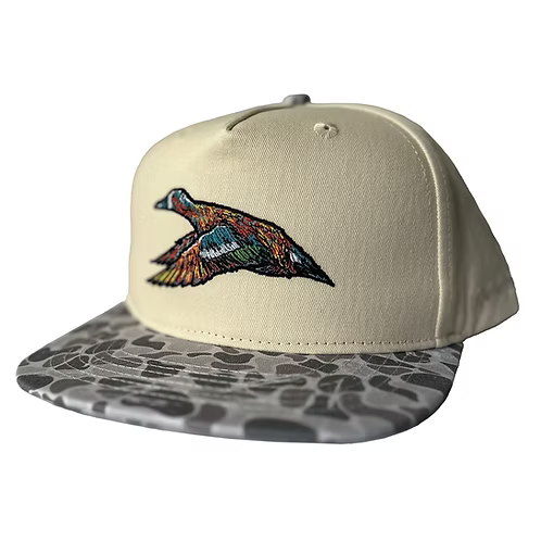 Beige cap with colorful bird design on the front and patterned gray visor on a white background