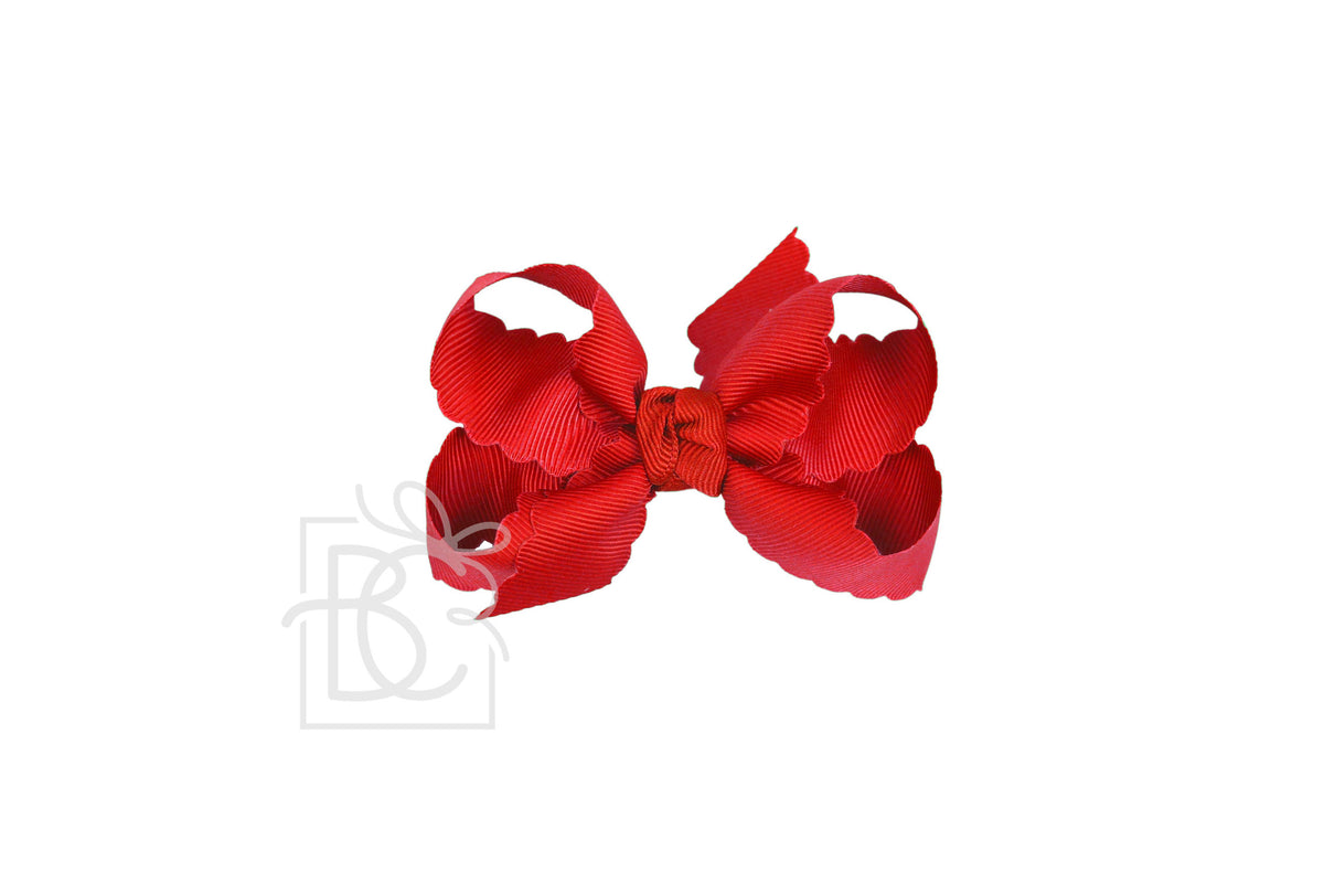 Red hair bow on a white background