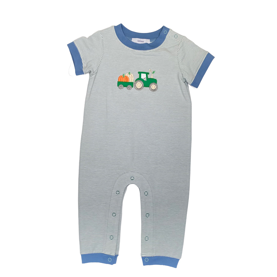 Striped baby romper with a tractor design on a white background