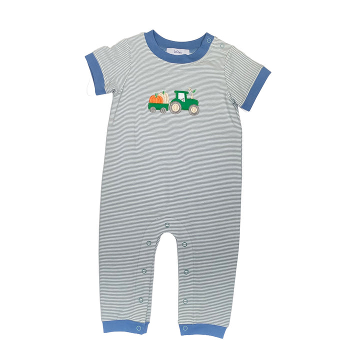 Striped baby romper with a tractor design on a white background