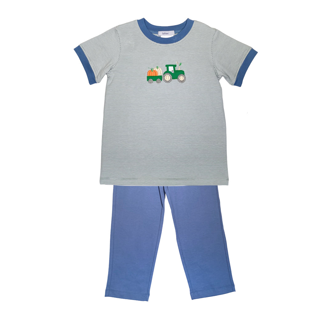 Children's pajama set with striped shirt and blue pants on a white background