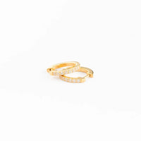 Gold ring with small diamonds on a white background