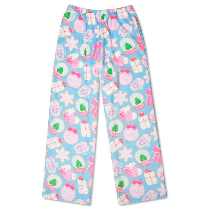 Colorful pajama pants with a pattern of stars, hearts, and gift boxes on a light blue background.