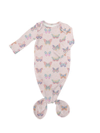 A baby footed sleeper in a pale pink color with an all-over pastel butterfly print, shown flat on a white background.