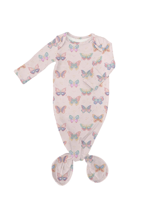A baby footed sleeper in a pale pink color with an all-over pastel butterfly print, shown flat on a white background.
