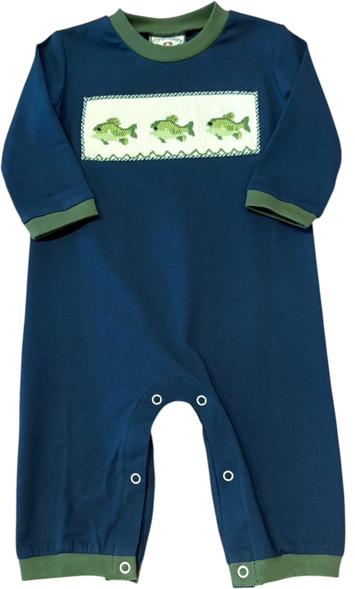 A navy blue baby jumpsuit with sage green trim on the collar, cuffs, and ankles, featuring a white rectangular chest panel with three green fish illustrations.